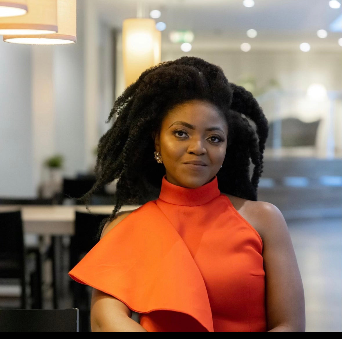 Miss Fluffy Crown herself looking nice in her hair after using the products she make